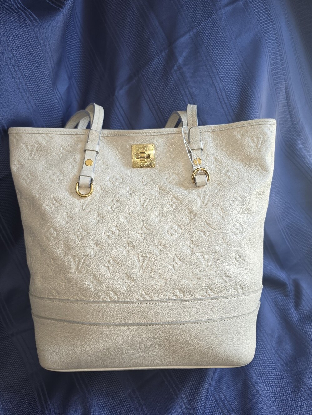 Louis Vuitton Empreinte Embossed Monogram Tote with Gold Accents
